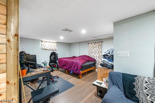 bedroom featuring recessed lighting and wood finished floors