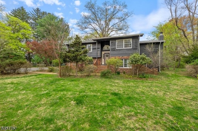 58 Clover Pl, Franklin Twp, NJ 08823 - split foyer home featuring a chimney, brick siding, and a front yard