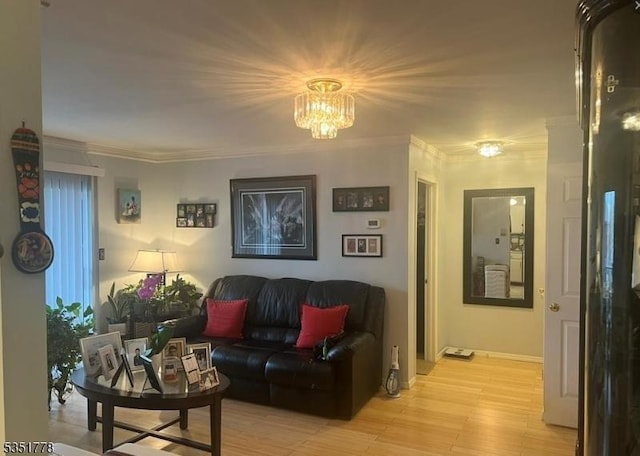 539 Bayway Ave Unit 2B, Elizabeth City, NJ 07202 - living room with a chandelier, light wood finished floors, and crown molding