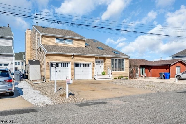 view of front of house with a garage and driveway