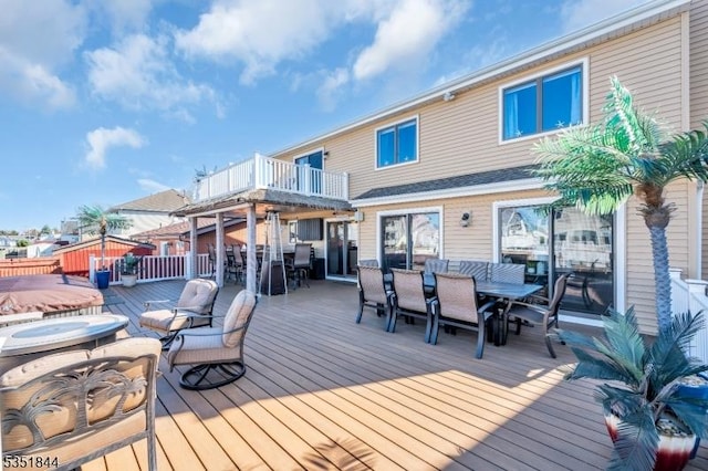 wooden terrace with outdoor dining area
