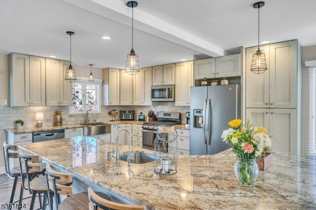kitchen with stainless steel appliances, recessed lighting, and a sink