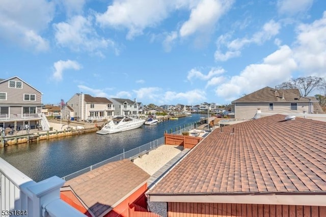 view of dock featuring a residential view and a water view