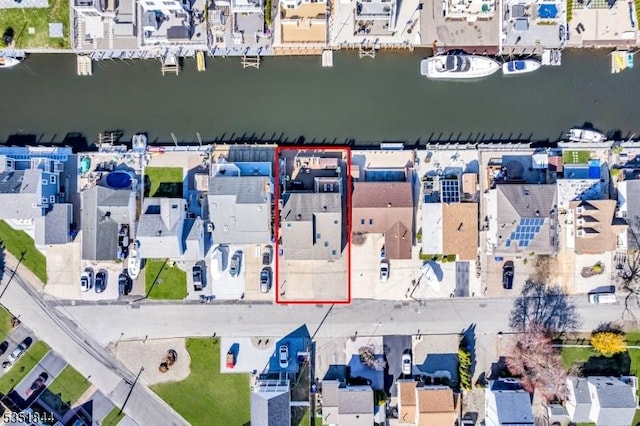 aerial view with a water view and a residential view