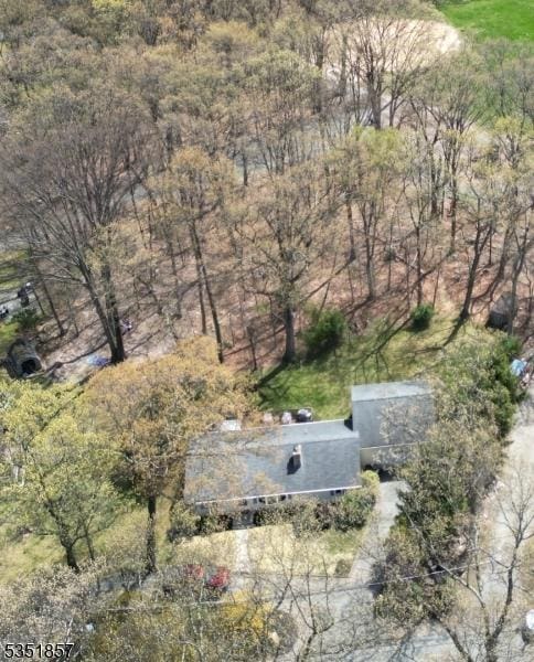 drone / aerial view with a view of trees