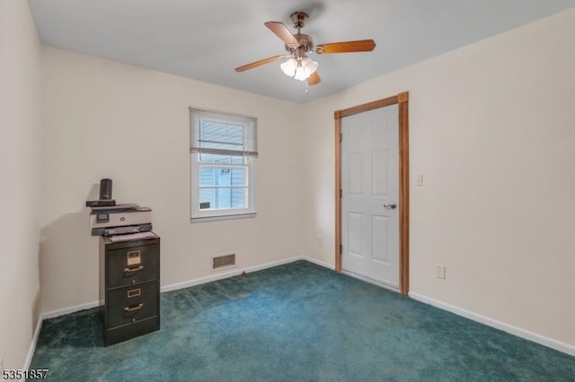 unfurnished room featuring a ceiling fan, baseboards, visible vents, and dark carpet