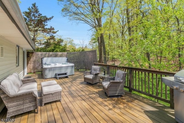 wooden terrace featuring a hot tub