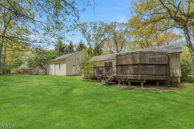 view of yard featuring a wooden deck