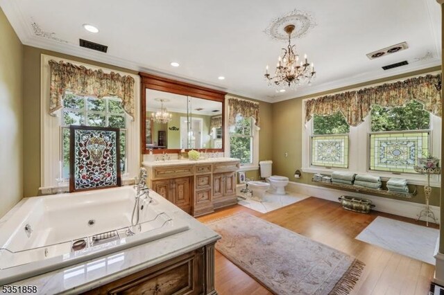 33 Edgemere Ave, Mount Arlington Boro, NJ 07856 - full bathroom with a chandelier, a jetted tub, toilet, and plenty of natural light