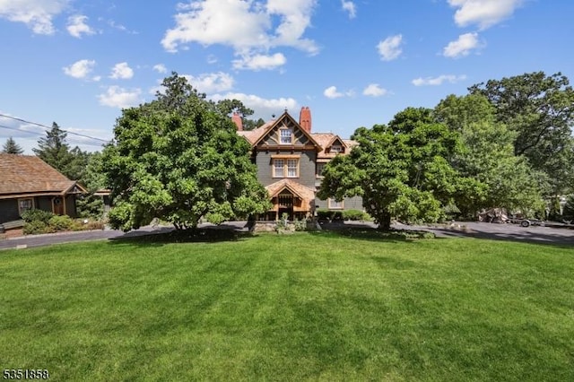 33 Edgemere Ave, Mount Arlington Boro, NJ 07856 - view of front of property featuring a front lawn and a chimney