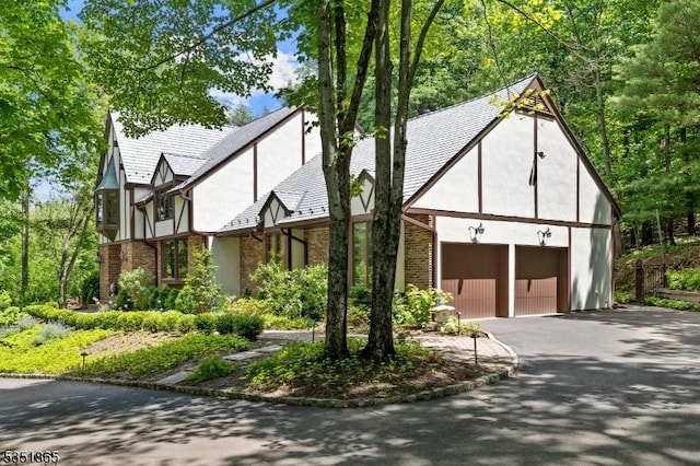 70 Friar Ln, Watchung Boro, NJ 07069 - english style home with a garage, brick siding, asphalt driveway, and stucco siding