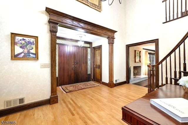 70 Friar Ln, Watchung Boro, NJ 07069 - foyer featuring light wood-style flooring, baseboards, stairway, and a chandelier