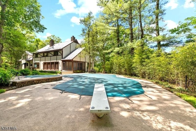 70 Friar Ln, Watchung Boro, NJ 07069 - view of pool with a diving board, a patio area, a covered pool, and a sunroom