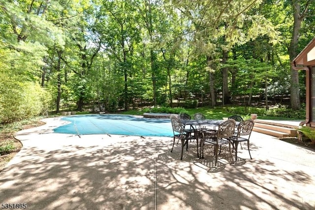 70 Friar Ln, Watchung Boro, NJ 07069 - view of swimming pool with a patio area, a covered pool, and a view of trees