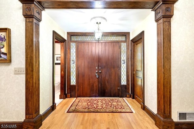 70 Friar Ln, Watchung Boro, NJ 07069 - entryway with light wood-style flooring, baseboards, and ornate columns