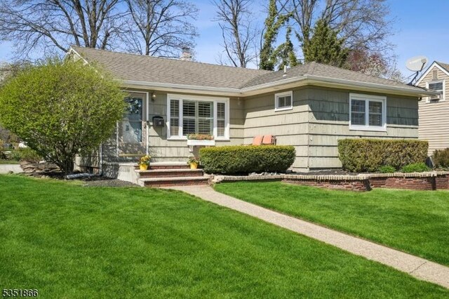 19 Whitman St, Bloomfield Twp, NJ 07003 - ranch-style house with roof with shingles and a front yard