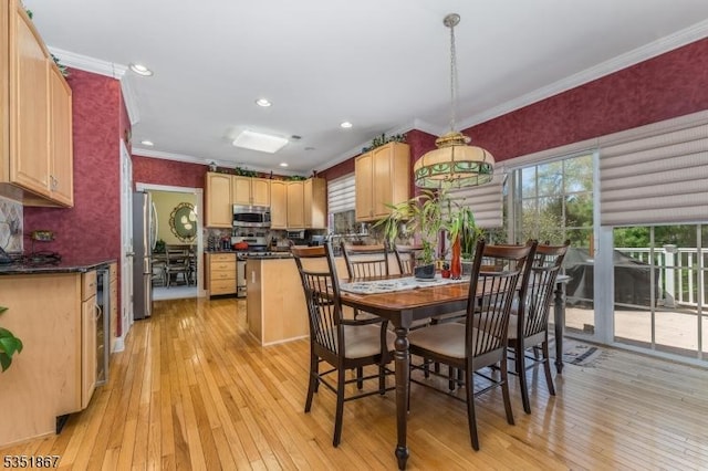 dining room with light wood-type flooring, ornamental molding, wine cooler, and recessed lighting