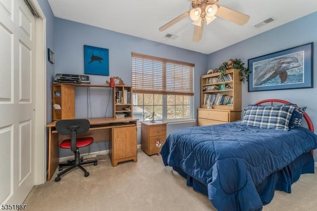 bedroom with visible vents and carpet