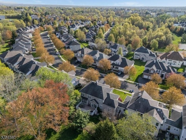 birds eye view of property with a residential view
