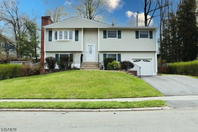 11 Kory Rd, Newton Town, NJ 07860 - raised ranch with an attached garage, aphalt driveway, a front yard, and a chimney