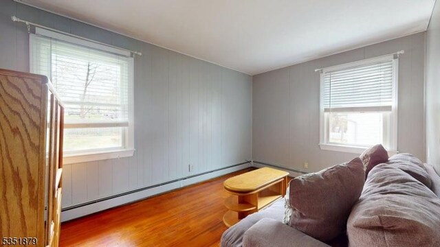 11 Kory Rd, Newton Town, NJ 07860 - living room featuring a baseboard heating unit and wood finished floors