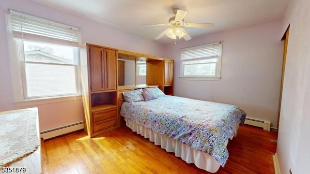 11 Kory Rd, Newton Town, NJ 07860 - bedroom featuring light wood-style floors, baseboard heating, and a ceiling fan