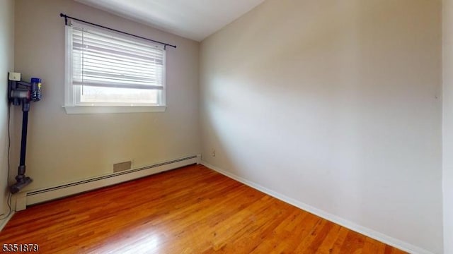 11 Kory Rd, Newton Town, NJ 07860 - unfurnished room with baseboards, light wood finished floors, and a baseboard heating unit