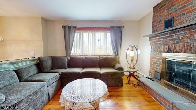 11 Kory Rd, Newton Town, NJ 07860 - living room with a baseboard radiator, wood finished floors, and a fireplace