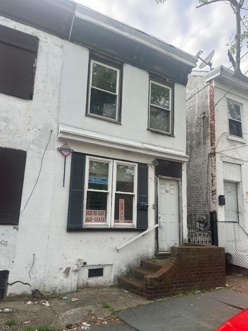 521 Mrtn King Jr Blv, Trenton City, NJ 08618 - view of front of house with stucco siding and entry steps