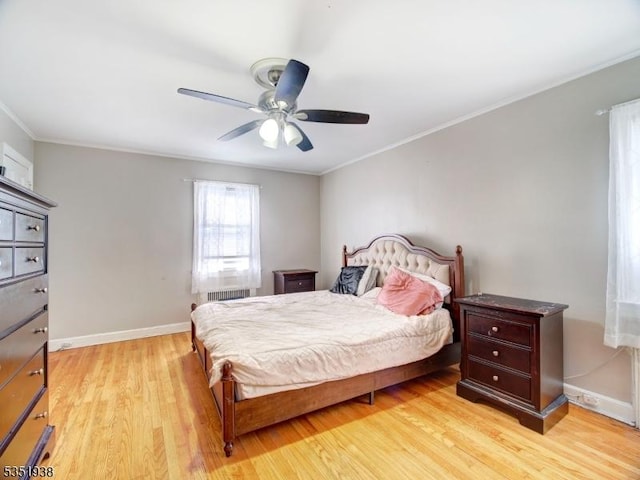 329 Hobson St, Newark City, NJ 07112 - bedroom with light wood-type flooring, crown molding, baseboards, and a ceiling fan