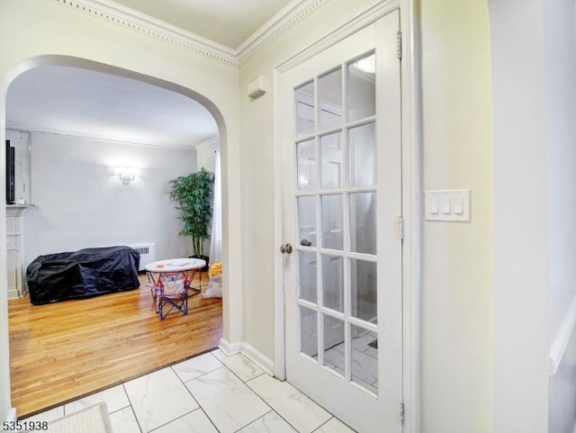 329 Hobson St, Newark City, NJ 07112 - doorway to outside with arched walkways, ornamental molding, and marble look tile flooring