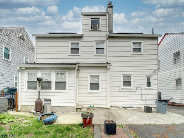 329 Hobson St, Newark City, NJ 07112 - back of house featuring a patio area and a chimney