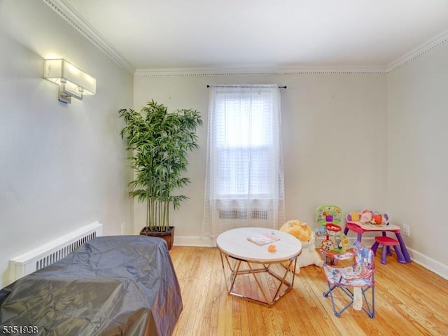 329 Hobson St, Newark City, NJ 07112 - bedroom featuring radiator heating unit, wood finished floors, crown molding, and baseboards
