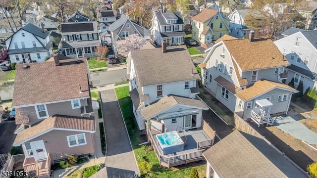 birds eye view of property with a residential view