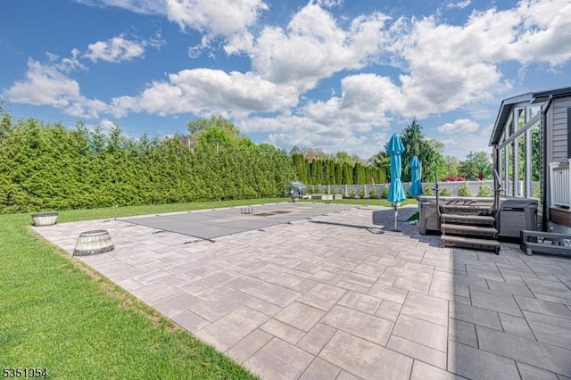 view of patio with a hot tub