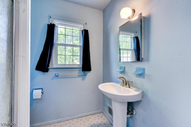 bathroom with baseboards