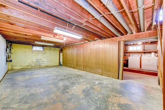 below grade area featuring washer and dryer