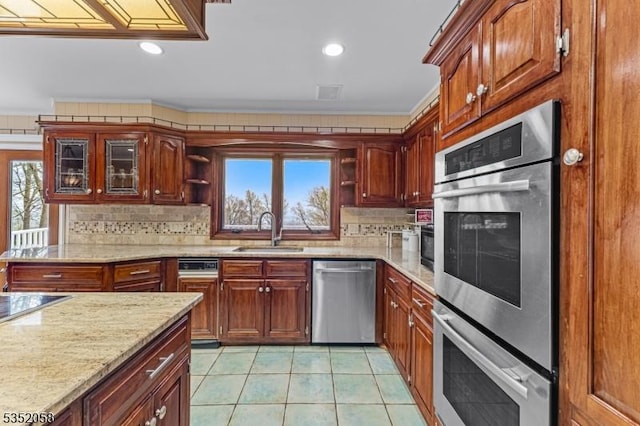 kitchen with a sink, light tile patterned flooring, backsplash, open shelves, and appliances with stainless steel finishes