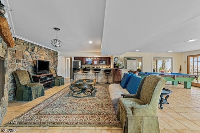 living room with a fireplace, light tile patterned flooring, pool table, and recessed lighting