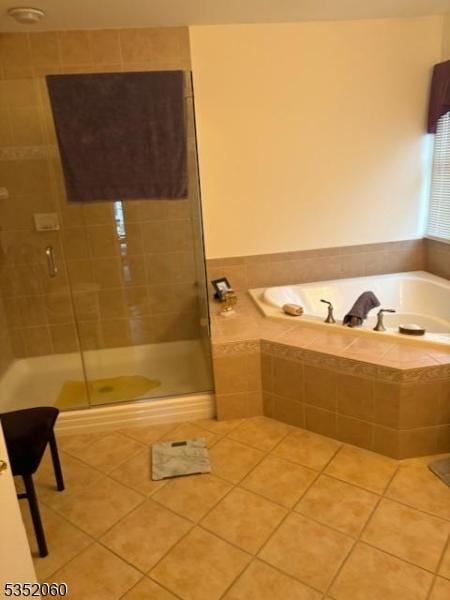 601 Buhler Ct, Pine Beach Boro, NJ 08741 - bathroom with tile patterned floors, a bath, and a shower stall