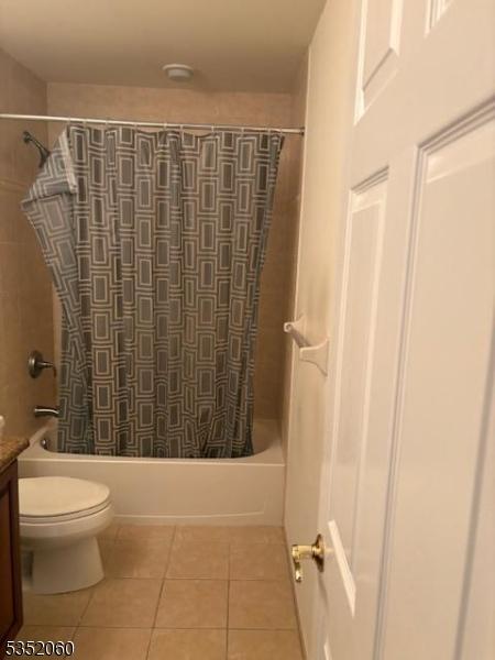 601 Buhler Ct, Pine Beach Boro, NJ 08741 - bathroom with tile patterned floors, toilet, vanity, and shower / tub combo