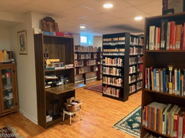 601 Buhler Ct, Pine Beach Boro, NJ 08741 - living area featuring wood finished floors and bookshelves