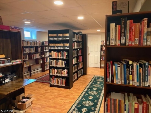 601 Buhler Ct, Pine Beach Boro, NJ 08741 - sitting room featuring wall of books and wood finished floors