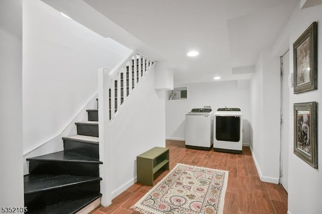 laundry area featuring separate washer and dryer, laundry area, recessed lighting, and wood finished floors