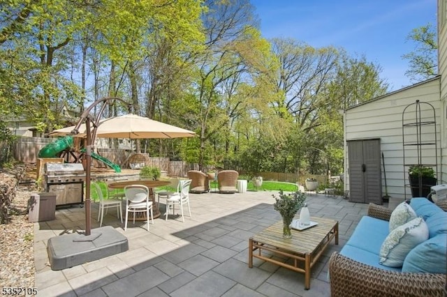 view of patio / terrace featuring outdoor lounge area, outdoor dining area, and a fenced backyard