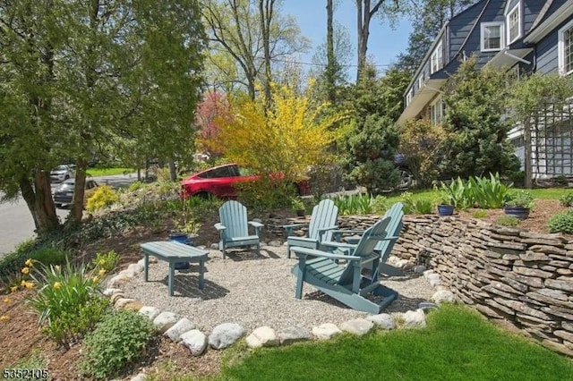 view of yard with a fire pit