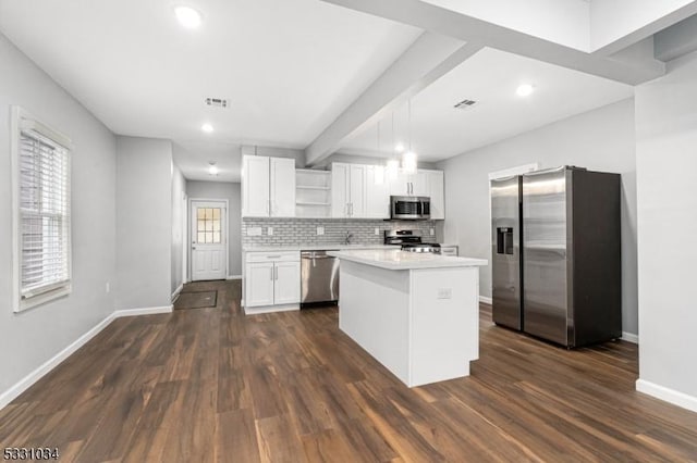 kitchen featuring baseboards, open shelves, stainless steel appliances, and visible vents