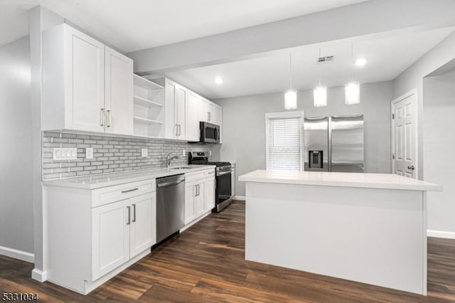 kitchen with stainless steel appliances, baseboards, visible vents, open shelves, and light countertops