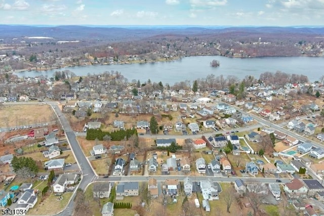 birds eye view of property featuring a residential view and a water view