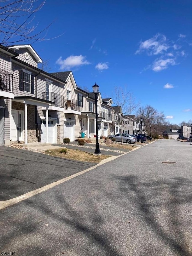 22 Joseph Dr, Newton Town, NJ 07860 - view of asphalt road featuring a residential view and street lighting